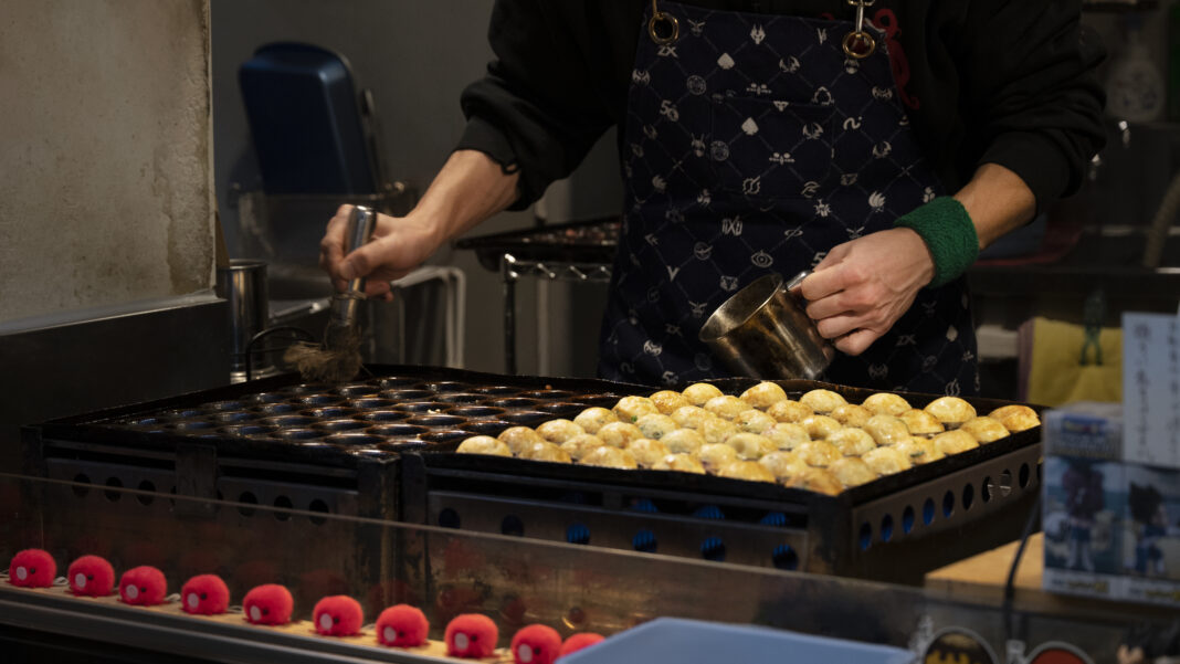close-up-person-cooking-japanese-street-food