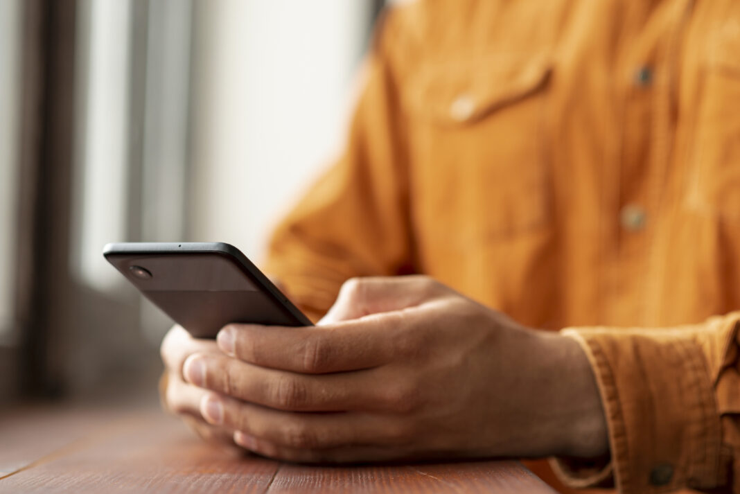 close-up-man-browsing-his-phone